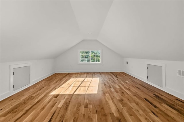 327 Ohm Ave, Avondale Estates, GA 30002 - additional living space featuring light wood-type flooring, vaulted ceiling, and baseboards