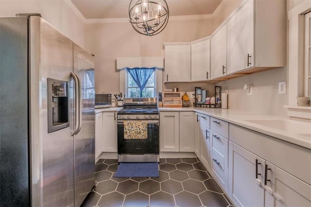 229 Slate St, Rockmart, GA 30153 - kitchen with stainless steel appliances, light countertops, ornamental molding, white cabinetry, and a chandelier