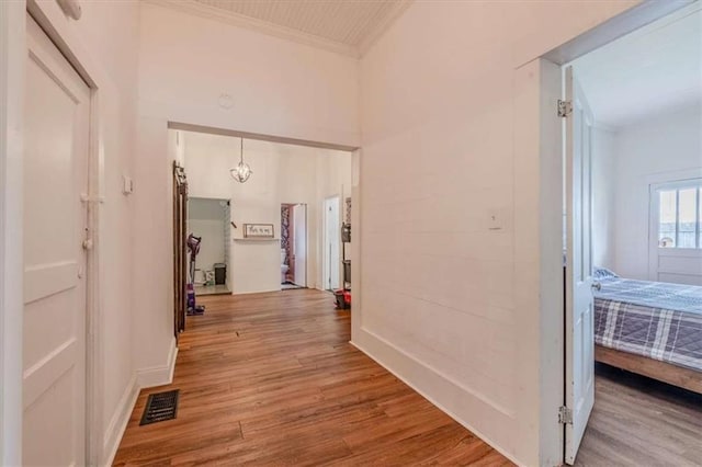 229 Slate St, Rockmart, GA 30153 - hallway featuring light wood-type flooring, crown molding, and baseboards