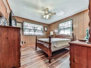 6267 Mount Pisgah Rd, Ellijay, GA 30540 - bedroom with wood walls and wood finished floors