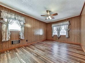 6267 Mount Pisgah Rd, Ellijay, GA 30540 - empty room with visible vents, baseboards, a ceiling fan, and wood finished floors