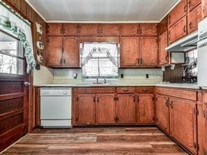 6267 Mount Pisgah Rd, Ellijay, GA 30540 - kitchen featuring light wood-type flooring, dishwasher, brown cabinetry, and light countertops