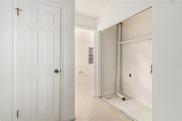 bathroom featuring visible vents, a textured ceiling, and baseboards