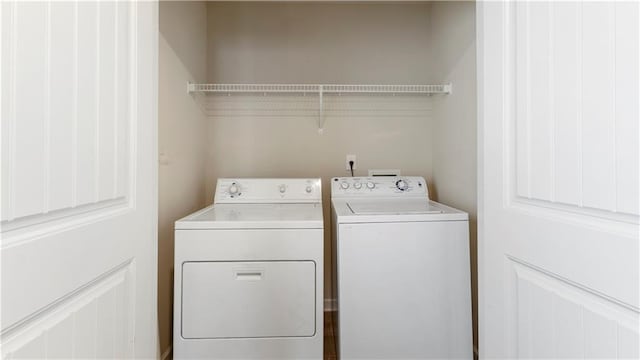 clothes washing area featuring laundry area and independent washer and dryer