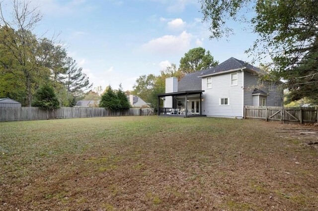 view of yard with a fenced backyard