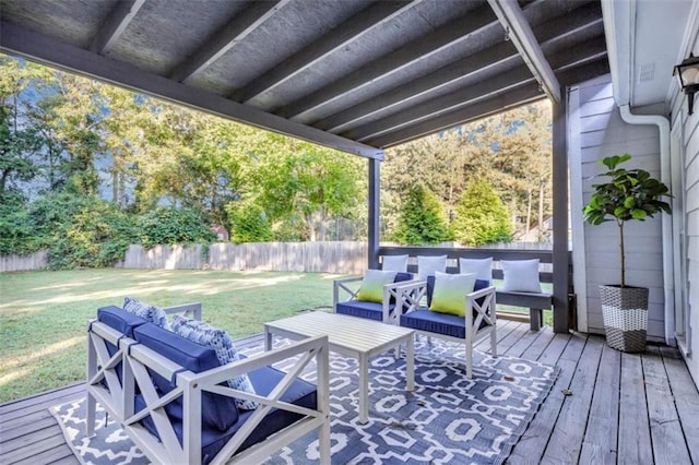 wooden deck featuring a fenced backyard, an outdoor hangout area, and a lawn