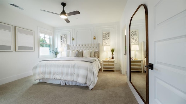carpeted bedroom featuring ceiling fan and baseboards