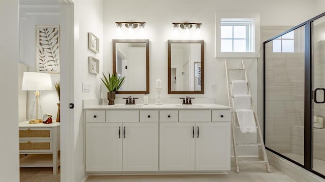 bathroom featuring a shower stall and double vanity