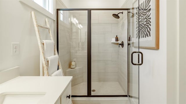 full bath featuring a stall shower and vanity