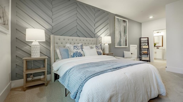 bedroom with carpet, baseboards, ensuite bathroom, and recessed lighting