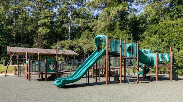 community jungle gym with view of scattered trees