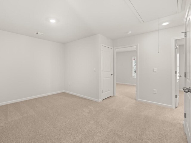 carpeted bedroom featuring visible vents and baseboards