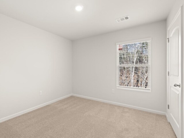 carpeted bedroom with a crib