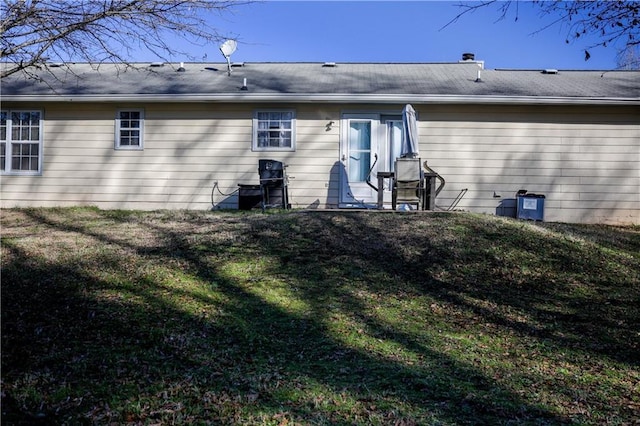 back of house with a yard