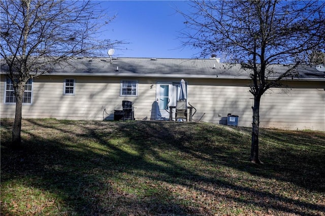 back of house with a yard