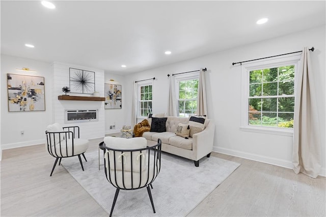 3614 N Druid Hills Rd N, Decatur, GA 30033 - living area with light wood finished floors, recessed lighting, baseboards, and a glass covered fireplace