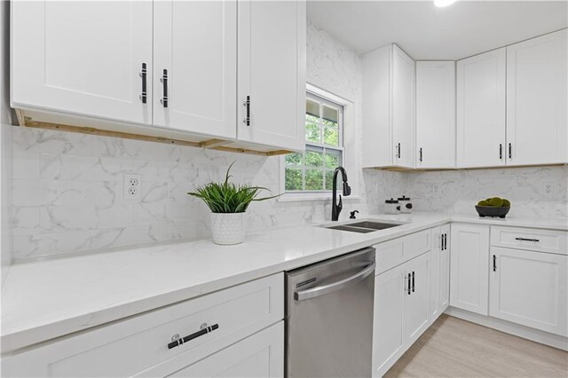 3614 N Druid Hills Rd N, Decatur, GA 30033 - kitchen featuring dishwasher, a sink, white cabinetry, and decorative backsplash