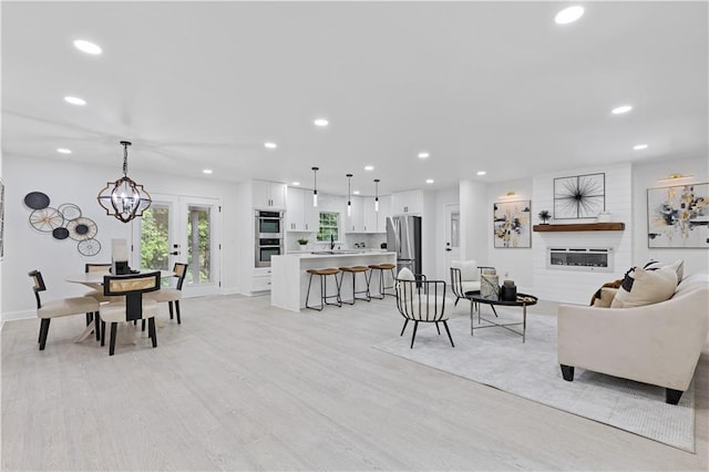 3614 N Druid Hills Rd N, Decatur, GA 30033 - living room featuring recessed lighting, light wood finished floors, french doors, and baseboards