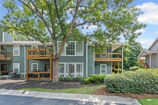 202 Berkeley Woods Dr, Duluth, GA 30096 - rear view of property featuring central AC and a wooden deck