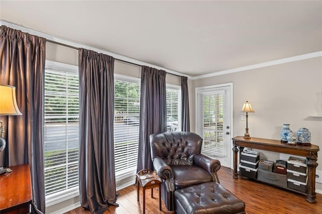 202 Berkeley Woods Dr, Duluth, GA 30096 - living area with crown molding, wood finished floors, and baseboards