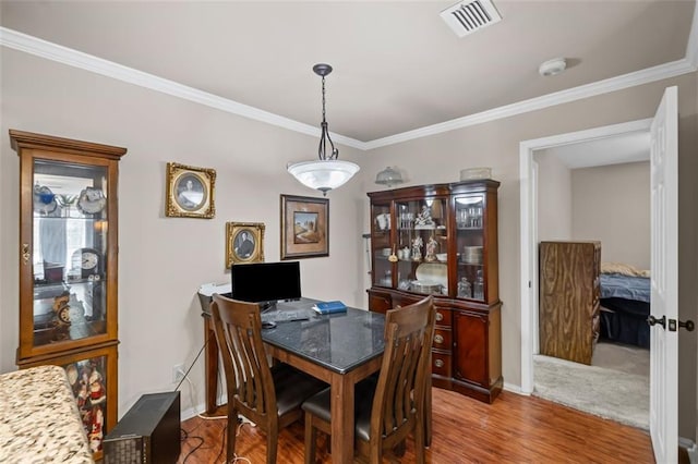 202 Berkeley Woods Dr, Duluth, GA 30096 - dining space with crown molding, baseboards, and wood finished floors