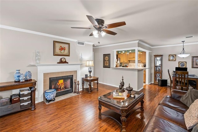202 Berkeley Woods Dr, Duluth, GA 30096 - living room with a ceiling fan, wood finished floors, a fireplace, ornamental molding, and baseboards