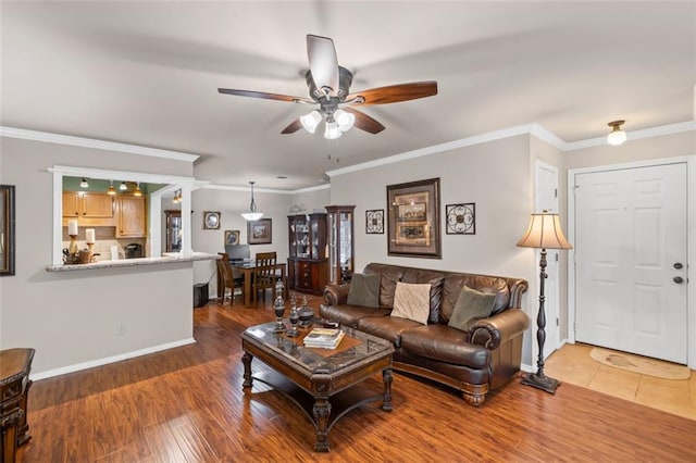 202 Berkeley Woods Dr, Duluth, GA 30096 - living room featuring a ceiling fan, baseboards, crown molding, and wood finished floors