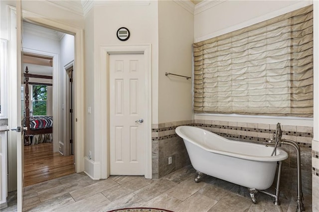 8970 Moor Park Run, Duluth, GA 30097 - full bathroom featuring crown molding, a soaking tub, tile walls, and wainscoting