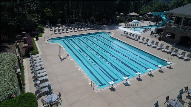 8970 Moor Park Run, Duluth, GA 30097 - community pool featuring a patio area and a water slide