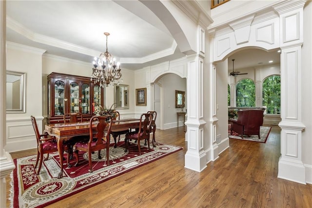 8970 Moor Park Run, Duluth, GA 30097 - dining room with arched walkways, decorative columns, a ceiling fan, wood finished floors, and ornamental molding