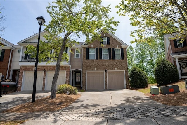 2548 Gadsen Walk, Duluth, GA 30097 - view of front of property featuring an attached garage, driveway, and brick siding
