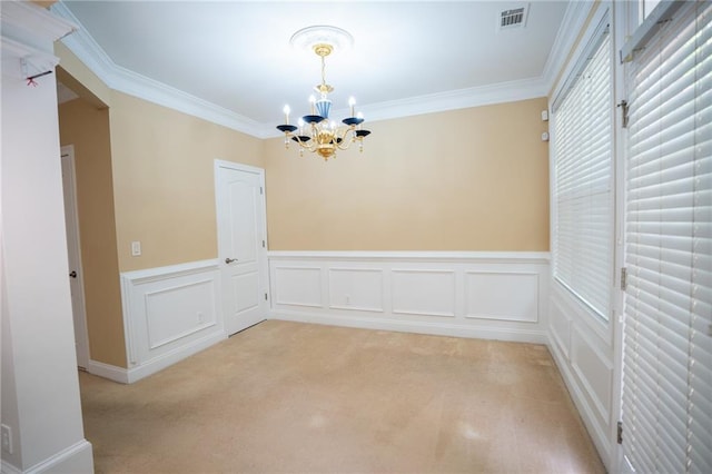 2548 Gadsen Walk, Duluth, GA 30097 - unfurnished dining area featuring an inviting chandelier, visible vents, crown molding, wainscoting, and light colored carpet