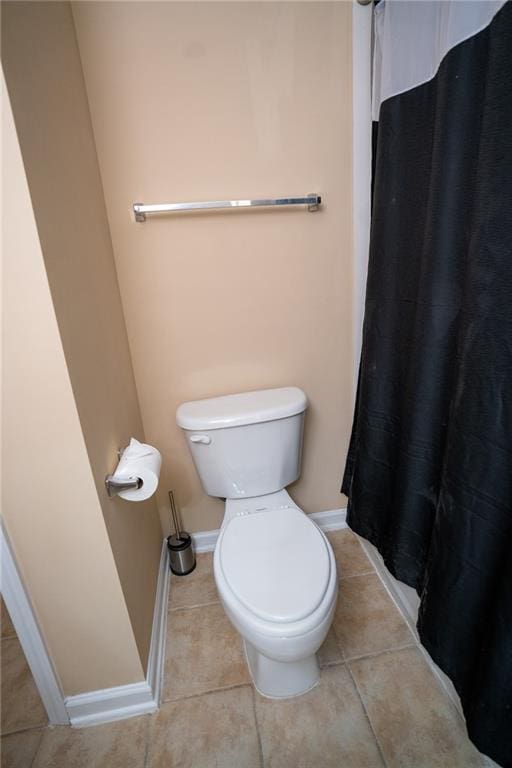 2548 Gadsen Walk, Duluth, GA 30097 - bathroom with tile patterned floors, baseboards, a shower with shower curtain, and toilet