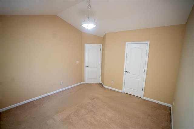 2548 Gadsen Walk, Duluth, GA 30097 - unfurnished room featuring light colored carpet, lofted ceiling, and baseboards