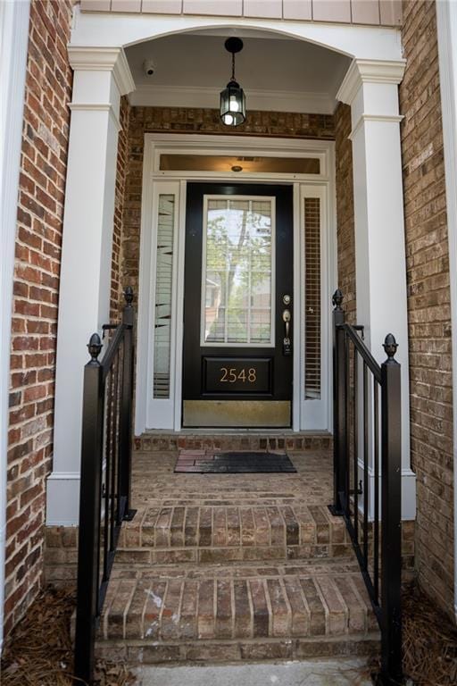 2548 Gadsen Walk, Duluth, GA 30097 - doorway to property featuring brick siding and covered porch