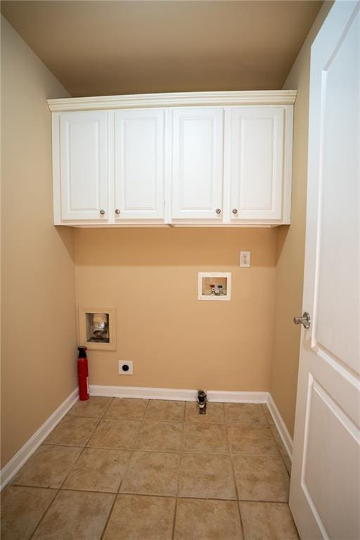 2548 Gadsen Walk, Duluth, GA 30097 - clothes washing area with baseboards, washer hookup, hookup for an electric dryer, and cabinet space
