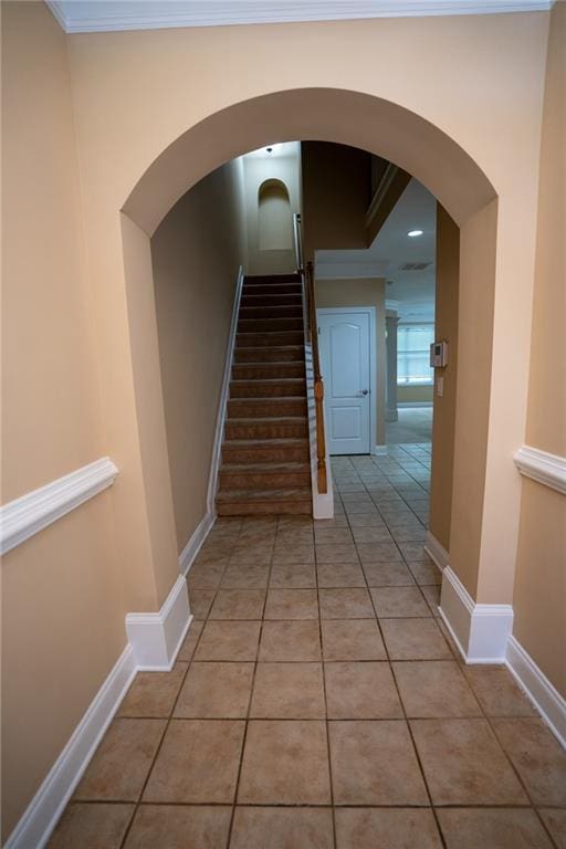2548 Gadsen Walk, Duluth, GA 30097 - stairs featuring arched walkways, baseboards, ornamental molding, and tile patterned flooring