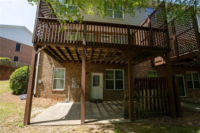2548 Gadsen Walk, Duluth, GA 30097 - back of property with fence, a patio, brick siding, and a deck