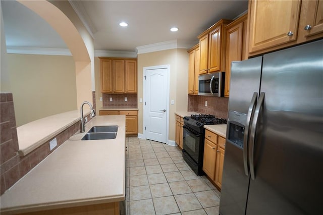 2548 Gadsen Walk, Duluth, GA 30097 - kitchen featuring arched walkways, ornamental molding, a sink, and appliances with stainless steel finishes