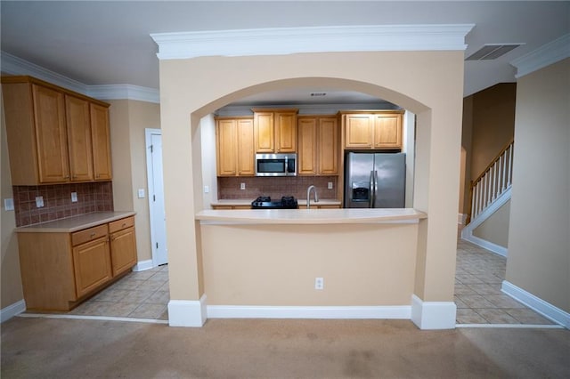 2548 Gadsen Walk, Duluth, GA 30097 - kitchen featuring stainless steel appliances, arched walkways, decorative backsplash, and ornamental molding