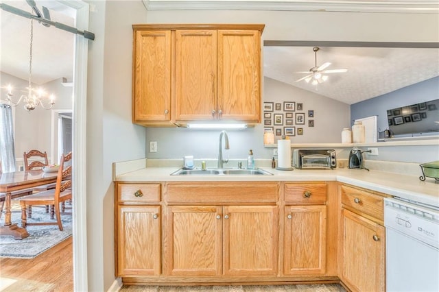 kitchen with ceiling fan with notable chandelier, dishwasher, lofted ceiling, light hardwood / wood-style floors, and sink