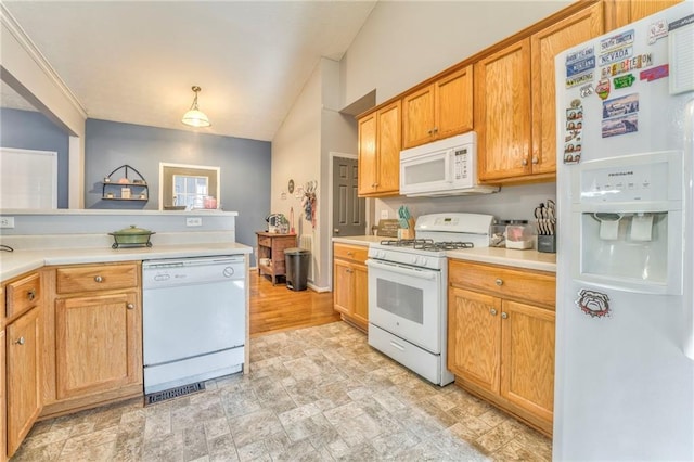 kitchen with white appliances and hanging light fixtures