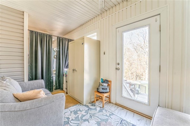 doorway with wooden walls