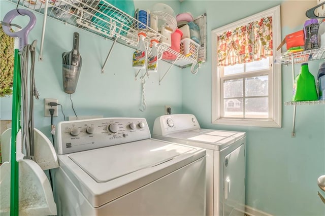 clothes washing area with washer and dryer