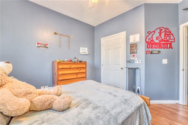 bedroom featuring ceiling fan and light wood-type flooring