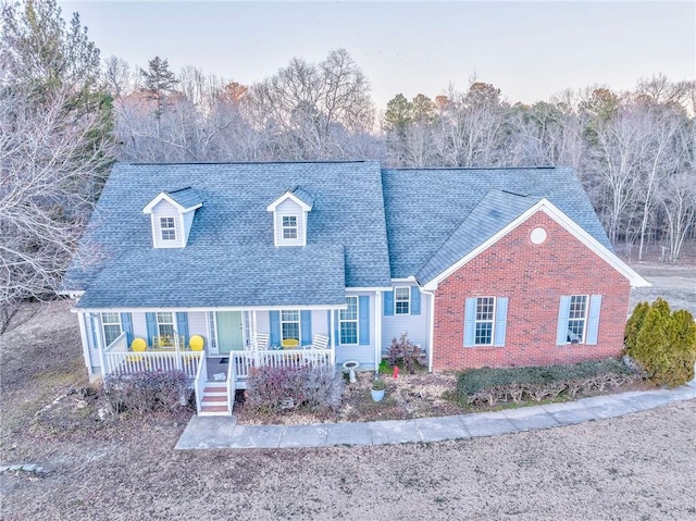 cape cod home with covered porch