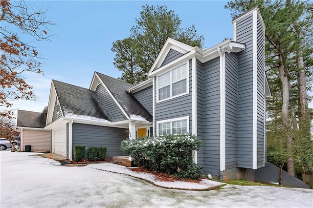 view of side of home with a garage