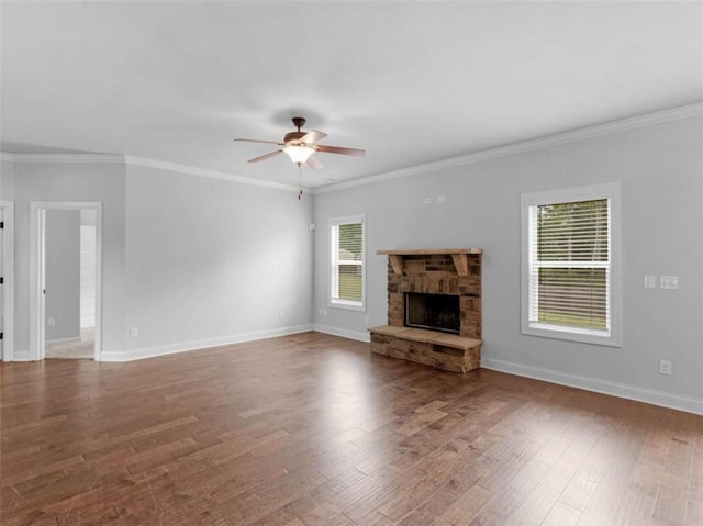 149 Elkins Blvd, Locust Grove, GA 30248 - unfurnished living room with ceiling fan, ornamental molding, wood finished floors, and a fireplace
