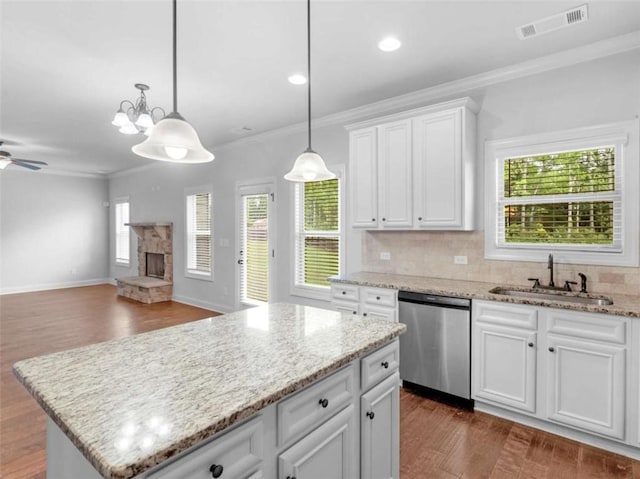 149 Elkins Blvd, Locust Grove, GA 30248 - kitchen with dishwasher, crown molding, dark wood-style flooring, ceiling fan, and decorative backsplash