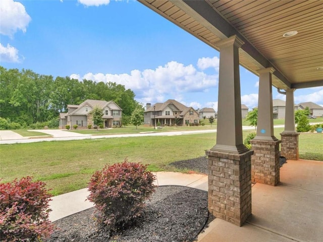 149 Elkins Blvd, Locust Grove, GA 30248 - covered porch featuring a residential view and a lawn